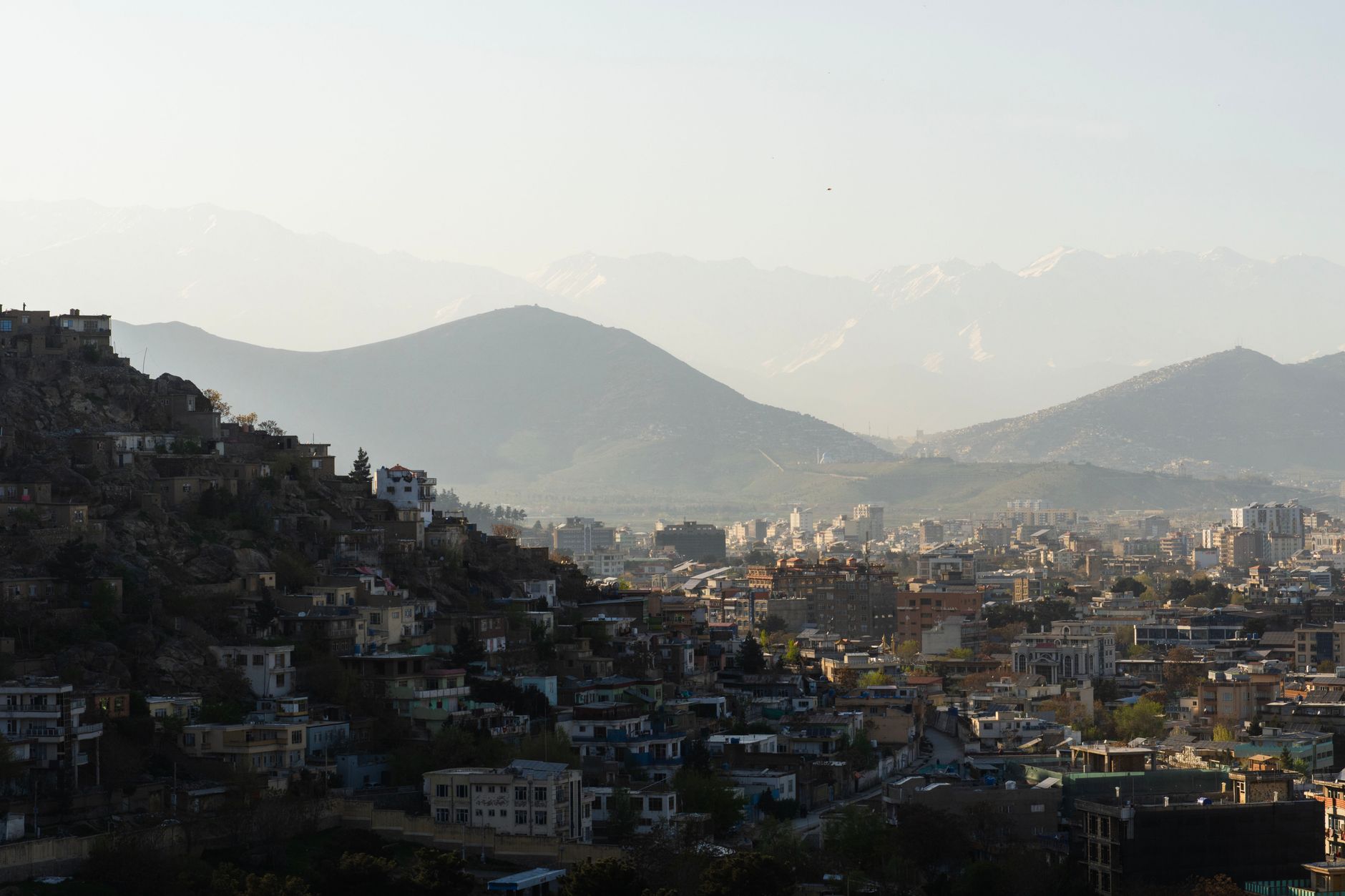 Kabul city on the hillsides with mountains behind